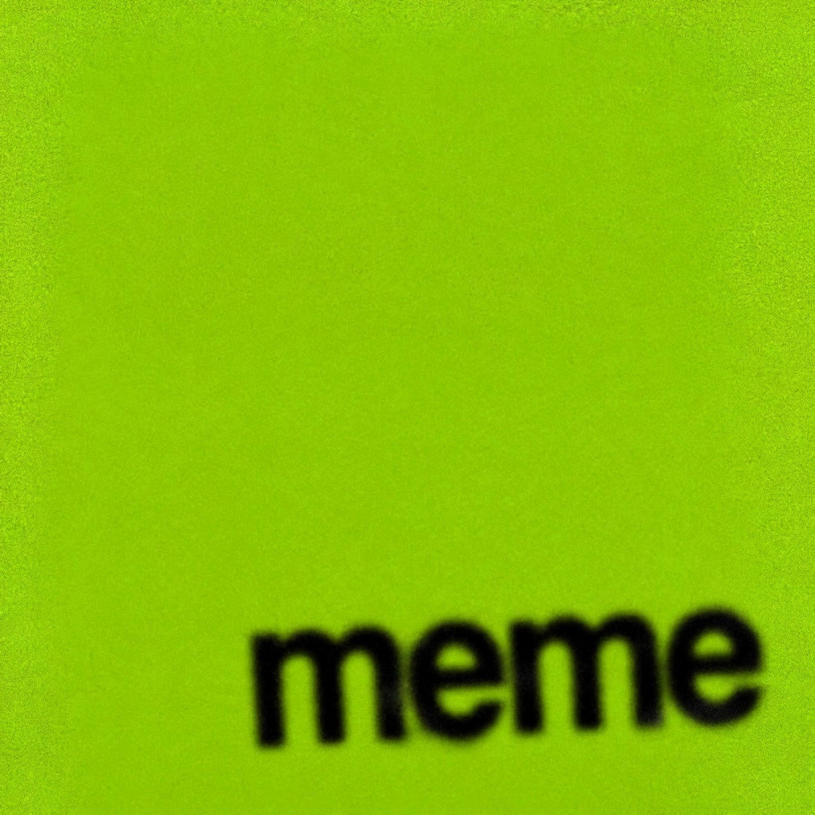 Lime green square with blurry black lowercase text reading meme in the brat album aesthetic