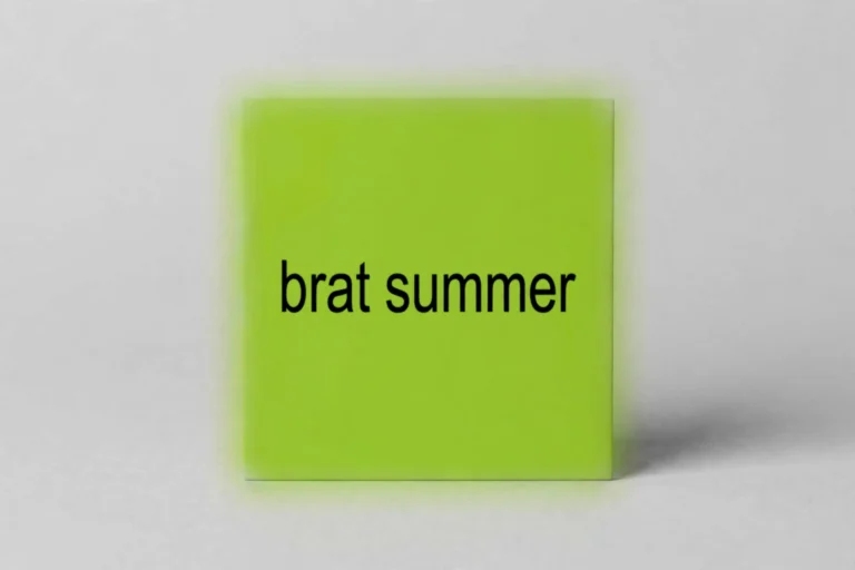 Lime-green square tile reading 'brat summer' in bold black lowercase text on a light grey background
